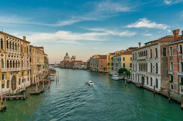 Fototapeta na wymiar Famous view of Basilica di Santa Maria della Salute and grand canal from Accademia Bridge, Venice, Italy.