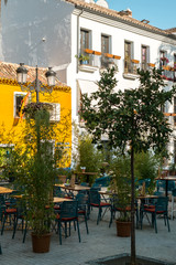 Marbella, Spain - August 26th, 2018. Typical old town street with Spanish architecture in Marbella, Costa del Sol, Andalusia, Spain, Europe