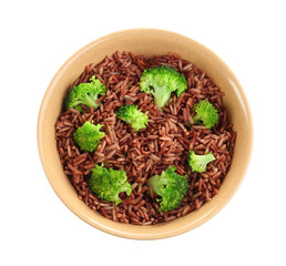 Delicious brown rice in bowl isolated on white, top view