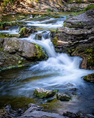 Fototapeta na wymiar Mountain stream in motion blur