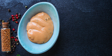 sauce in a sauceboat (fresh serving) menu concept background. top view. copy space