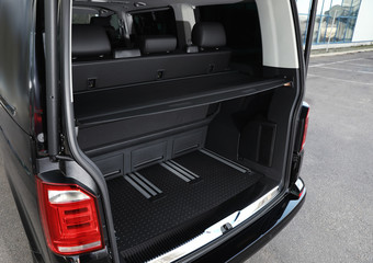 Modern car with open empty trunk outdoors