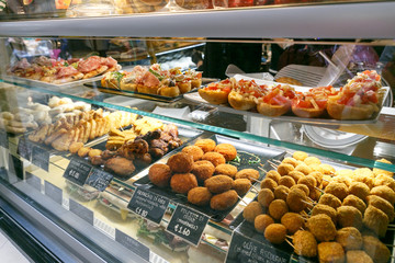meat snacks, sandwiches on display in an Italian store or bar