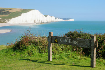 Cliff edge warning sign at Seven Sisters Country Park near Seaford East Sussex England United...