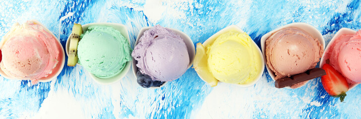 Various of ice cream flavor whit fresh blueberry, strawberry, kiwi, lemon, vanilla setup on rustic background . Summer and Sweet cold ice cream