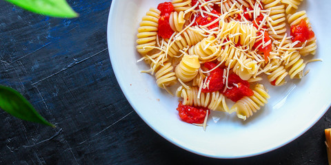 pasta rotini tomato sauce (vegetarian dish, Italian cuisine) menu concept. background. top view. copy space