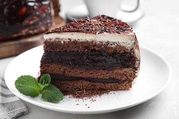 Tasty chocolate cake served on table, closeup