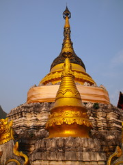 Fototapeta premium Temple in Chiangmai Thailand Beautifully decorated with wonderful colours statues of Buddha, Payanak, and Monks on walking street in the old city