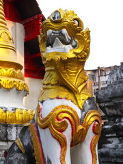 Temple in Chiangmai Thailand Beautifully decorated with wonderful colours statues of Buddha, Payanak, and Monks on walking street in the old city