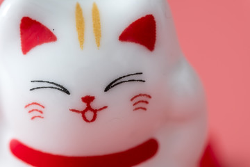 ceramics happy cat figure on pure color background view