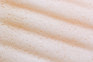 Foam lather texture background. White cleanser gel, shaving foam, shampoo bubbles. Foamy skin care product