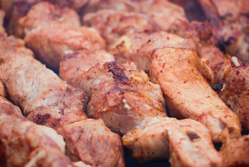 Fresh meat shish kebab fried and smoked on a charcoal grill.