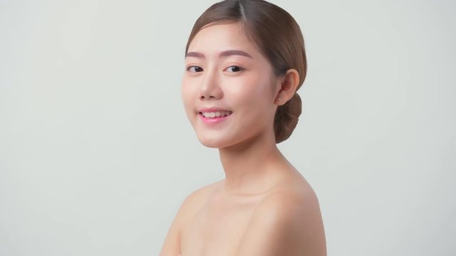 4k uhd facial beauty skin concept asian female attractive and healthy skin closeup hand touch softy face with care and freshness white background