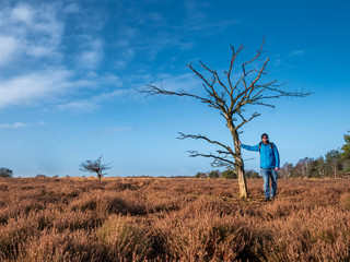 Lonely Hiking man at dry nature