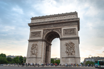 Arch of Triumph (Arc de Triomphe)  in "Les Champs-Élysées" of Paris, France visited by a multitude of tourists