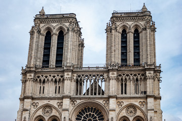 Obraz premium Photo of the towers of the Notre Dame cathedral in Paris, France on a cloudy day