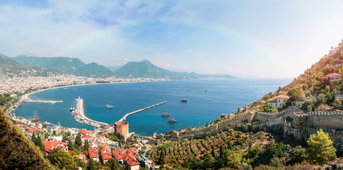 Fototapeta premium Beautiful rainbow on panoramic view of Alanya shore, Turkey