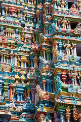 Great Indian architecture and religious art. Gods pantheon at Temple Gopuram (tower) facade Ancient colorful statues of Mahabharata Heroes South India