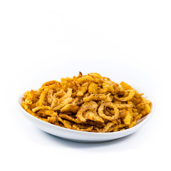 Crispy Fried Onion Strings with Garlic and Pepper Isolated on White Background. Selective focus.