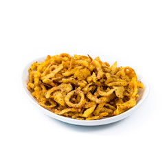Crispy Fried Onion Strings with Garlic and Pepper Isolated on White Background. Selective focus.