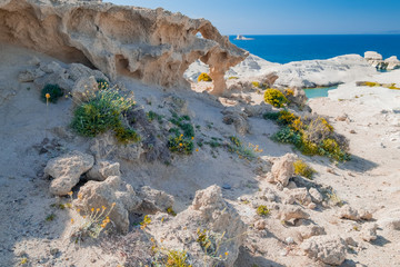  Amazing landscape with white volcanic rocks at Sarakiniko beach. Turquoise Aegean sea and blue sunny sky. Unique mediterranean nature of Milos island, Greece. Travel destination and vacation paradise