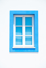 A closed window with a blue frame in Albufeira, Algarve, Portugal