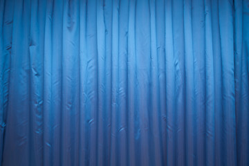 Blue panel background wallpaper texture . Blue Stage Curtain . Blue closed curtain with light spots...