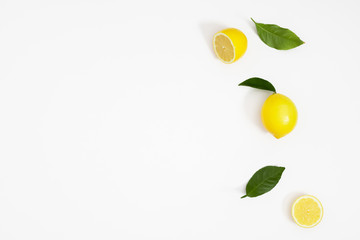 Creative pattern made of lemon and leaves. Lemon on white background. Food concept. Flat lay, top...