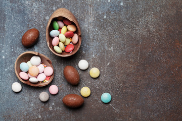 Easter greeting card backdrop with chocolate eggs