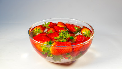 strawberries close-up in a glass bowl