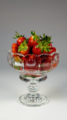 strawberries close-up in a glass bowl