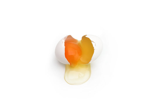 Broken chicken egg isolated on white background. Close up