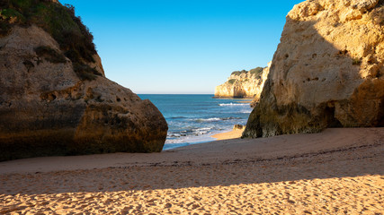 high cliffs and high tide on the shore of the Atlantic Ocean. Portugal. Algarve.