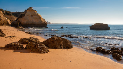 high cliffs and high tide on the shore of the Atlantic Ocean. Portugal. Algarve.