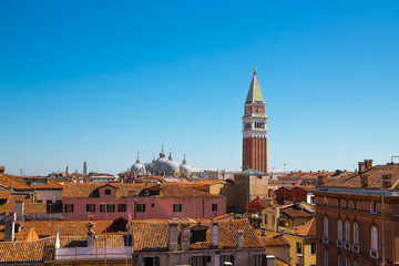Panoramic view of the roof and the bell tower in San Marco in the distance.