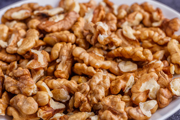 Walnuts shelled. Peeled Raw Walnuts. Fresh organic Nuts. Raw nuts. Many delicious Walnuts as a food background.