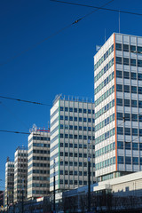 Obraz premium The modernist skyscrapers made of glass and aluminum in the center of Poznan..