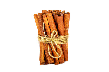 Cinnamon sticks tied with a rope isolated on white background. Cinnamon sticks tied in a pile isolated on a white background.