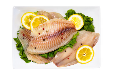Whitefish Tilapia Fish Raw Fillet Isolated on White Background. Selective focus.