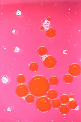 Red bubbles on pink background