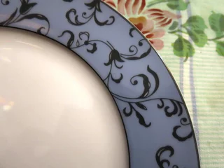  a festive plate with a blue border is on the table © Lumatis