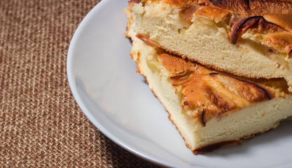 Food photo. The pie is in a white plate close-up.