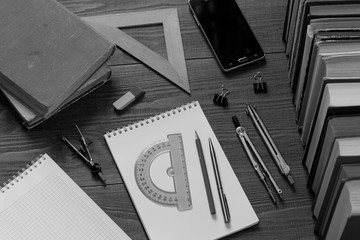 drawing instruments, notebooks and books to prepare for math or drawing