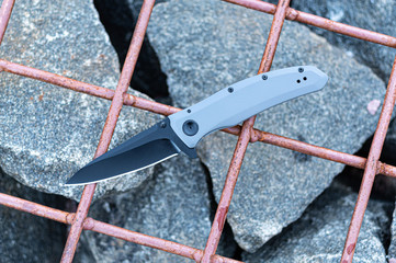 Pocket knife in the color of stone. Pocket knife for everyday carry.