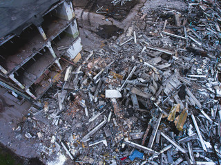 A process of buliding demolition, demolition site with heavy bulldozer and excavator with crushing...