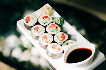 delicious vegan rolls with vegetables on a white plate in a health food restaurant. vegan food