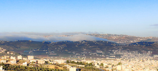cloudy sky and fog come over village  