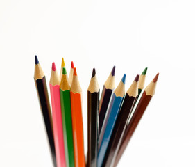 set of colored pencils on a white background