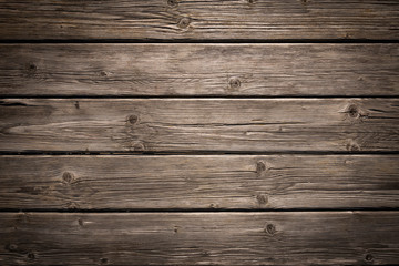 Fototapeta na wymiar Dark wooden background texture. Old fence panels with natural patterns.
