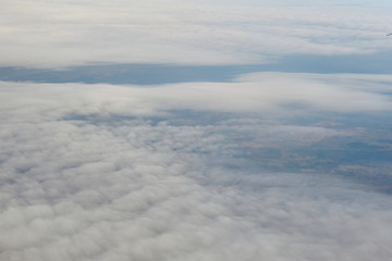 Top view on dense white clouds.